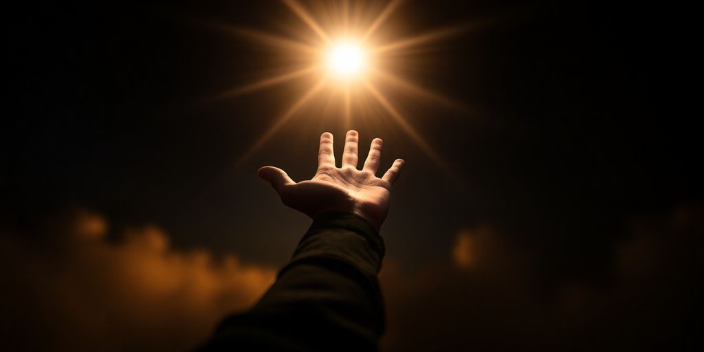 Person reaching for glowing light symbolizing opportunity.