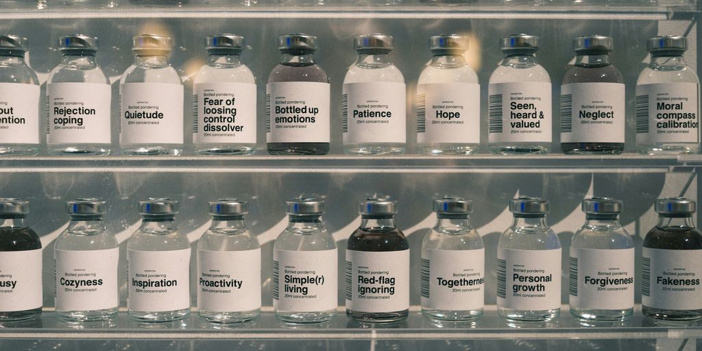 Many glass bottles lined up on shelves.
