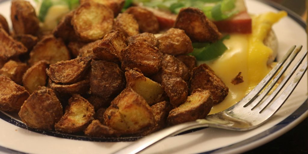 A plate of food with a fork and knife