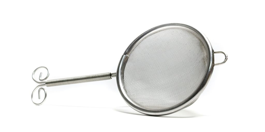 stainless steel strainer on white background