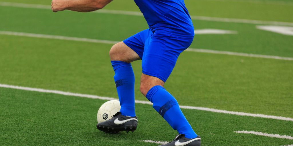 person in blue and white nike soccer jersey