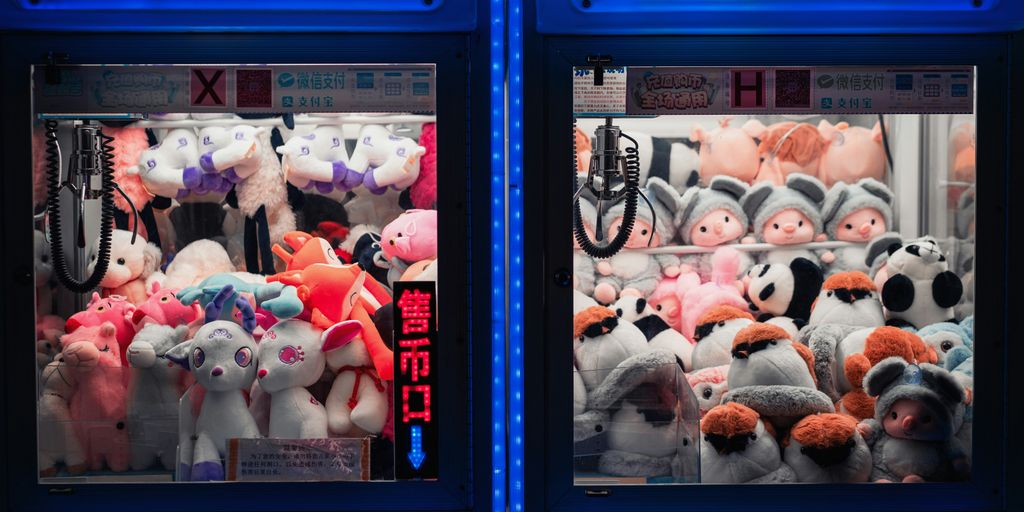 plush toys in blue plastic cabinet