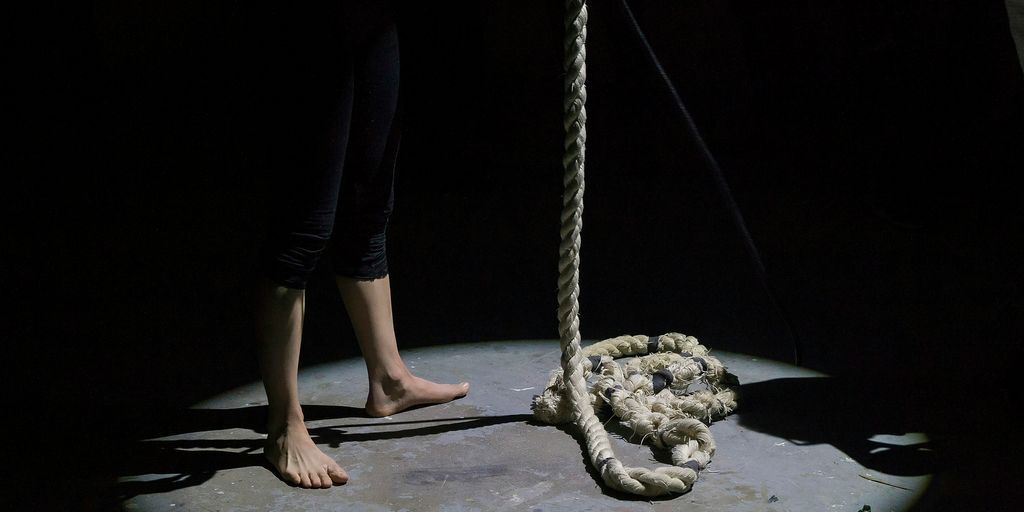 man holding brown rope