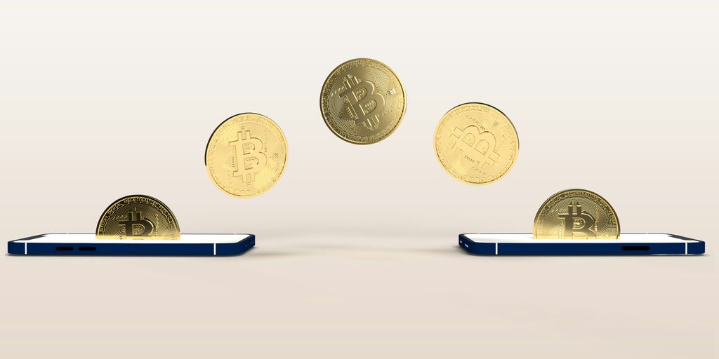 a bunch of coins flying out of a cell phone