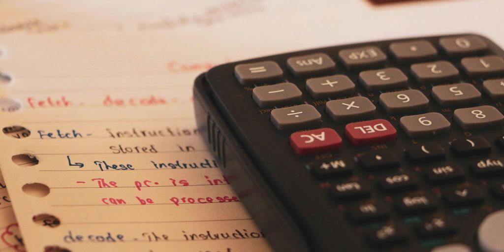a calculator sitting on top of a piece of paper