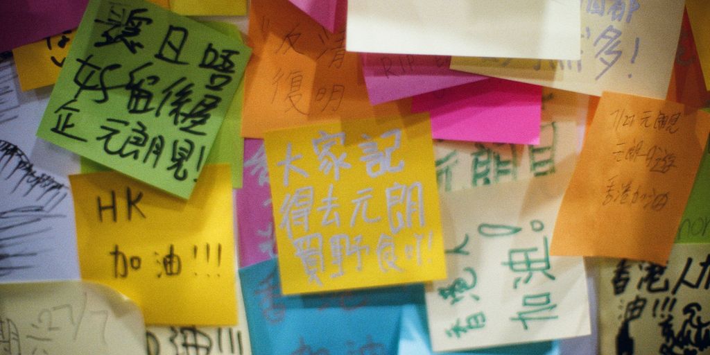 a bunch of colorful sticky notes attached to a wall