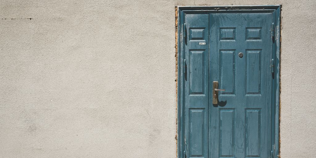 closed door and white painted wall