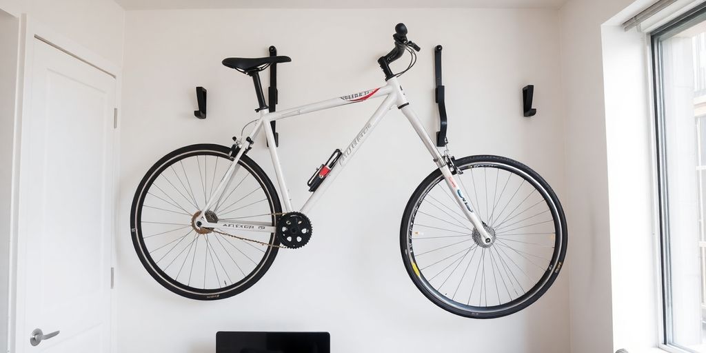 Bicycles mounted on wall clips in a small apartment.
