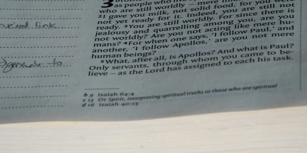 A close up of a newspaper with a clock on it