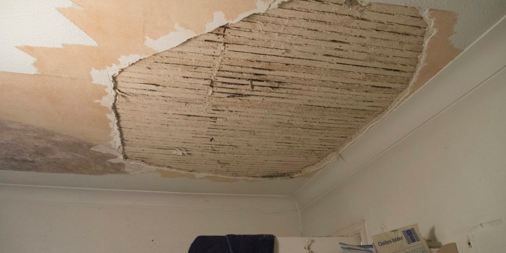 A room with a ceiling that has been torn off