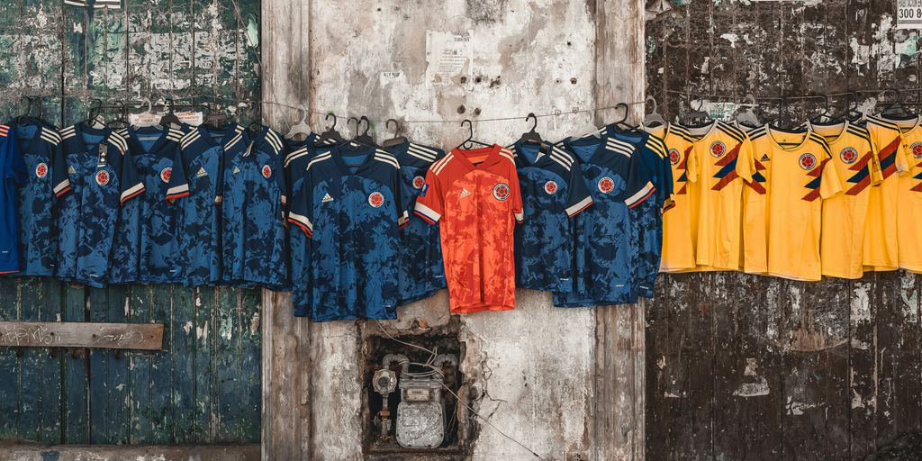a bunch of shirts hanging on a wall