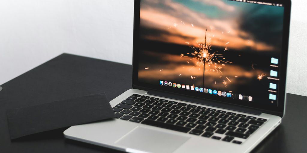 MacBook Pro on wooden table