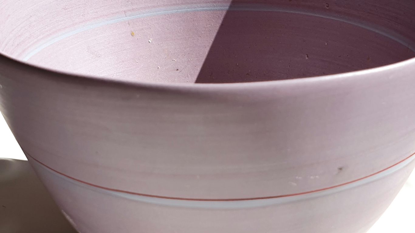 a close up of a bowl on a table