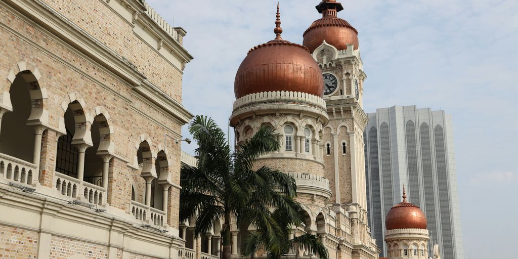 a large building with a clock on the top of it