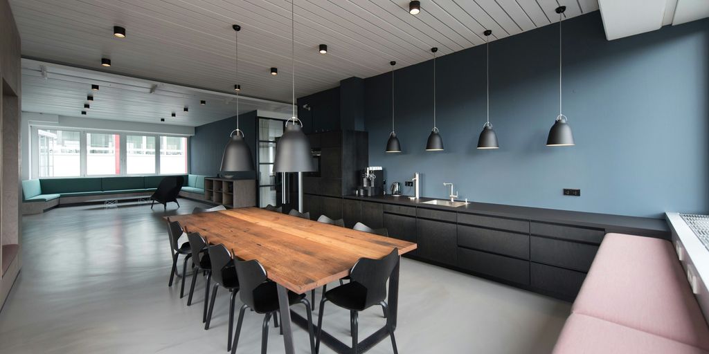 room with pendant lamps and rectangular dining set