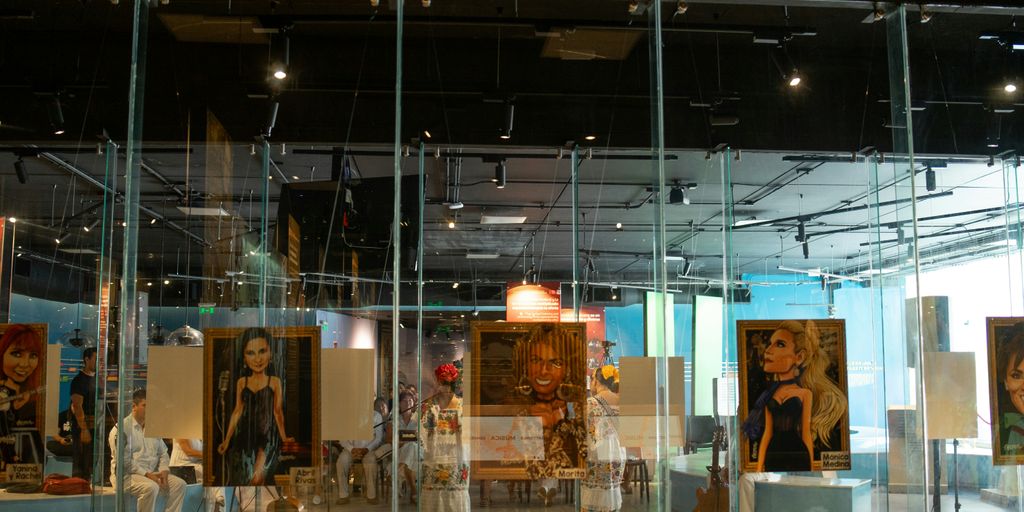 Paintings and statues are displayed in a museum.