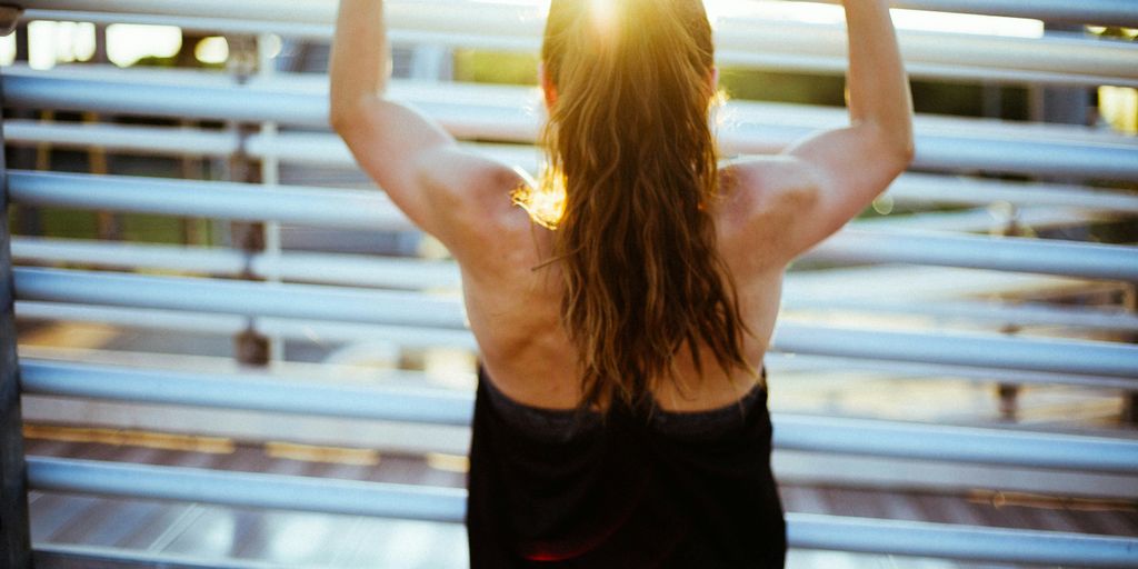 woman doing pull up exercise