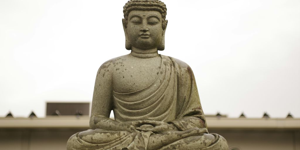 gray concrete statue of a man
