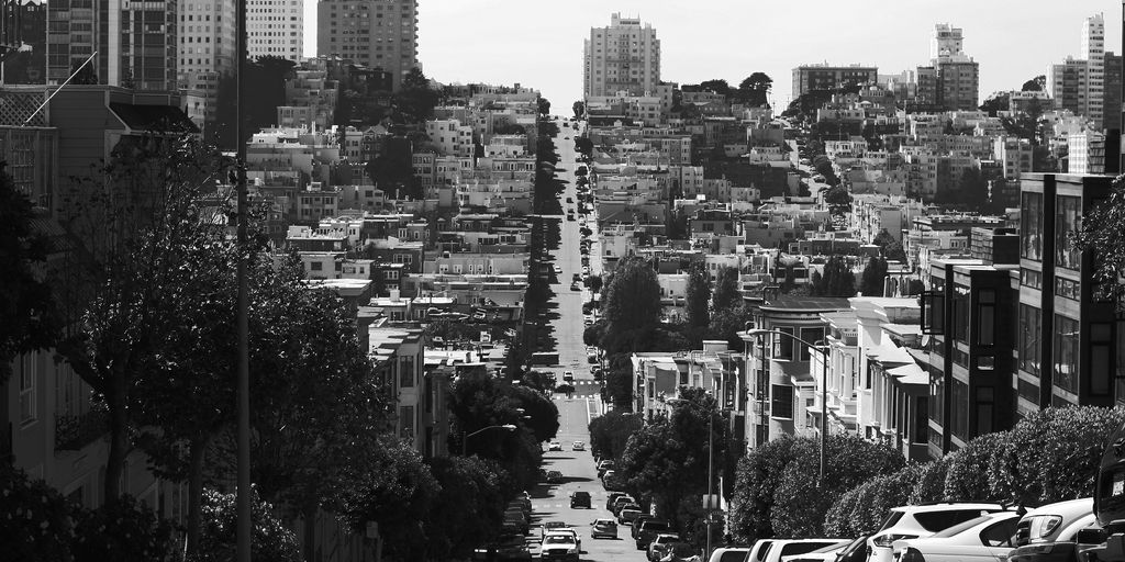 gray pave road on high-city buildings