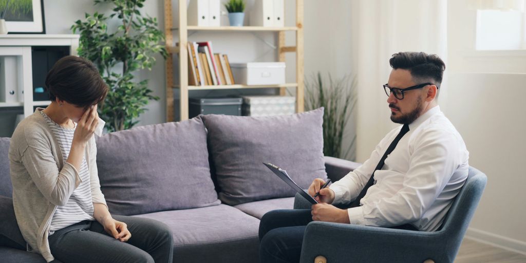 a man and a woman sitting on a couch
