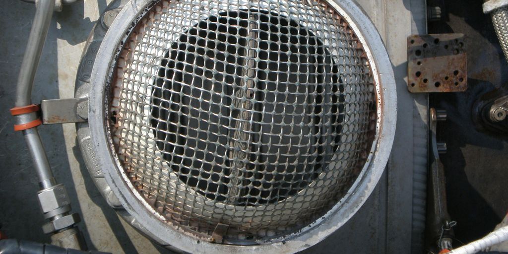 a close up of a metal object with wires