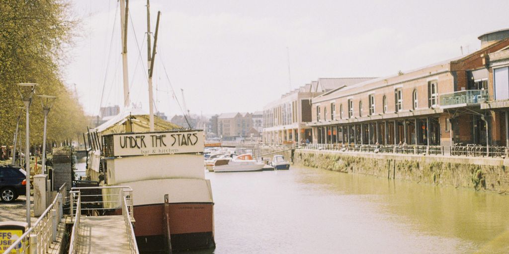a boat is docked at a dock in the water
