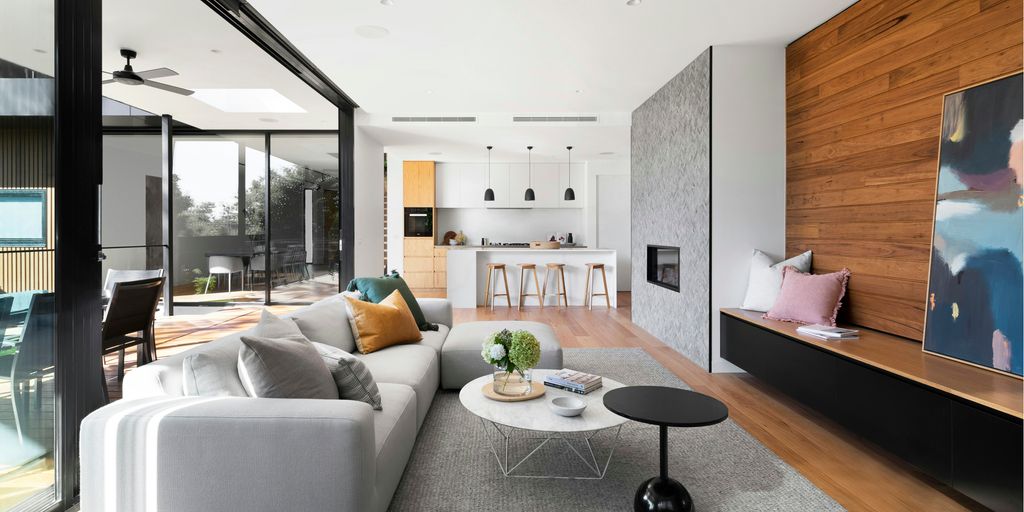 white couch beside brown wooden table