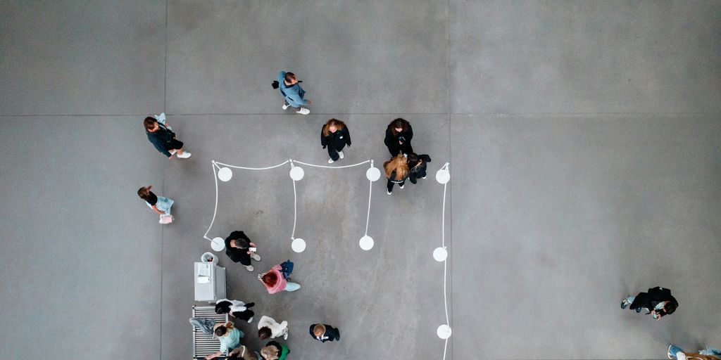 A group of people standing around a building