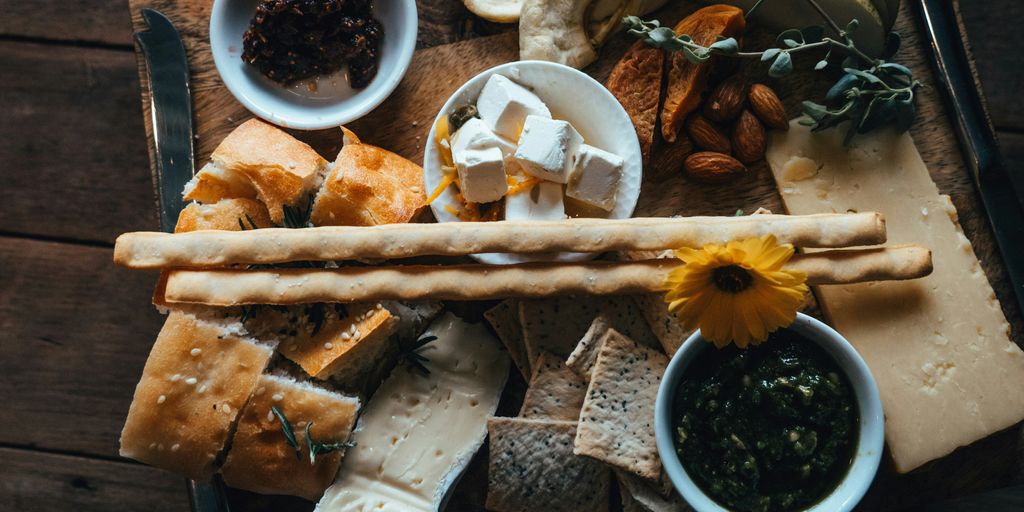 a wooden table topped with different types of food