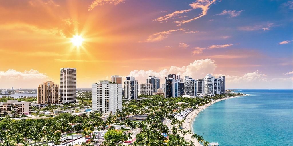 Colorful Aventura, Florida landscape with palm trees and skyline.