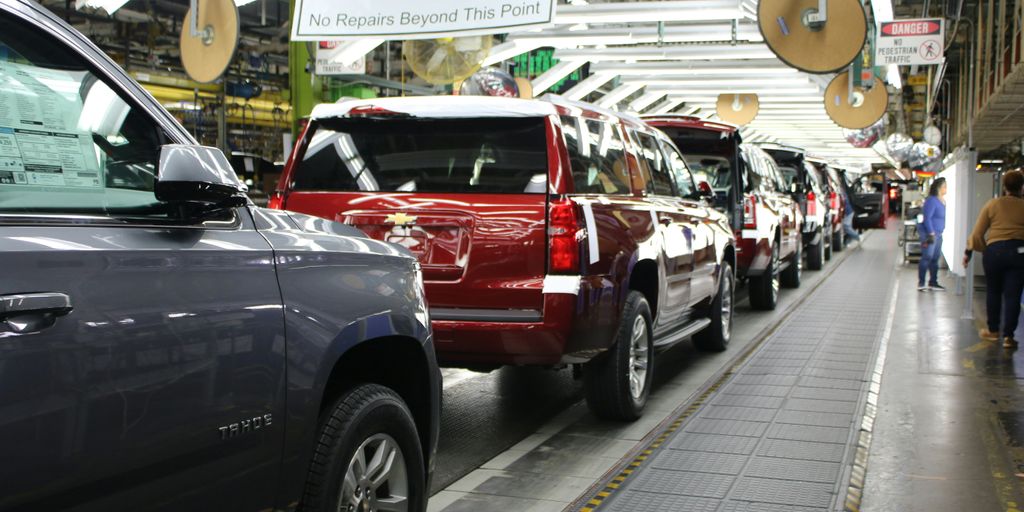a row of cars parked in a parking lot