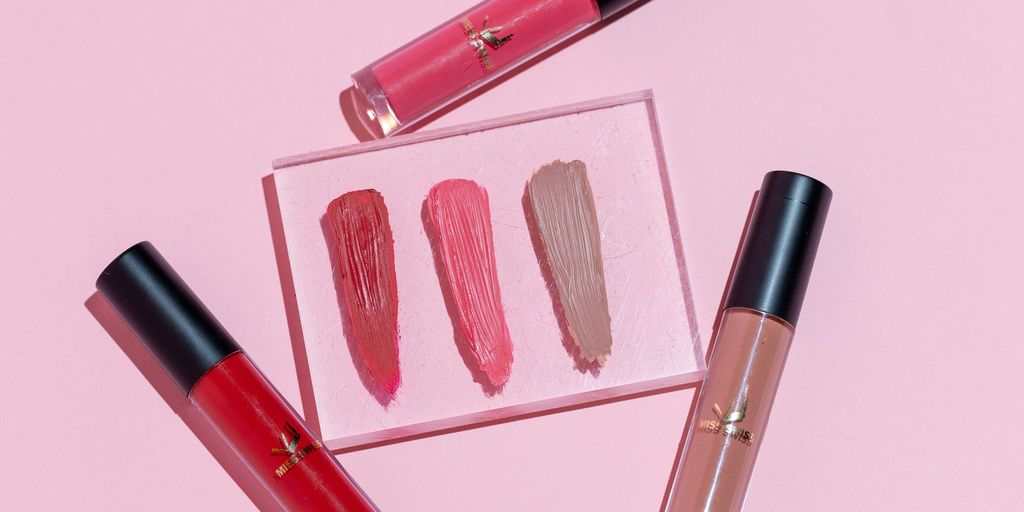 pink and black lipstick and make up brush