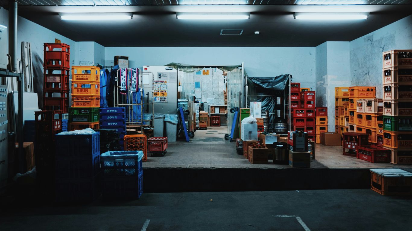 landscape photography of plastic crates in a garage