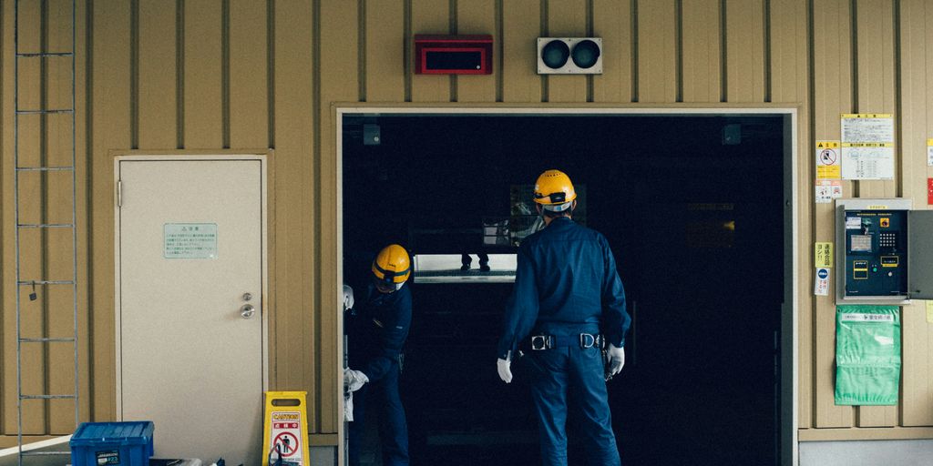 man standing in front of open doorway