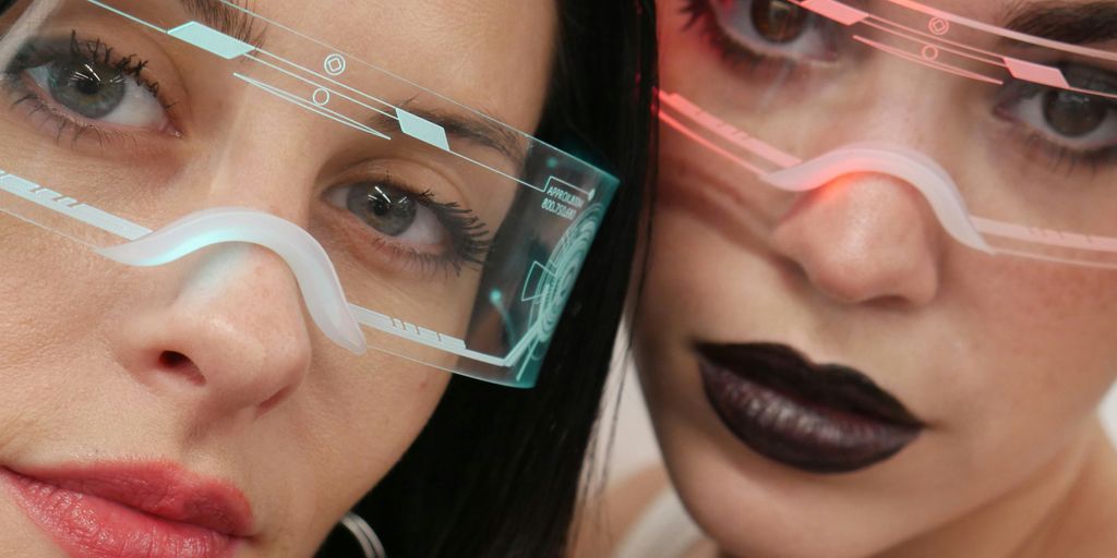 Two beautiful women wearing glasses and black lipstick