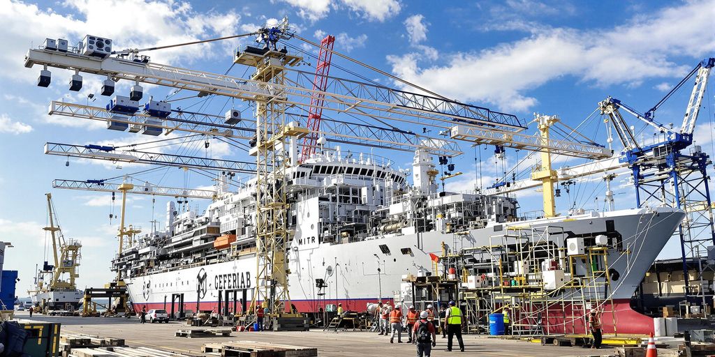 Brazilian shipyard with modern ships and construction activities.