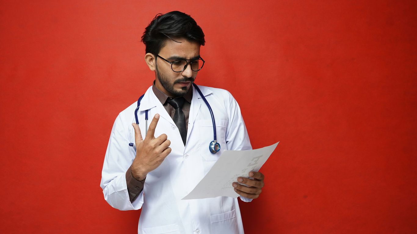 a doctor holding a clipboard