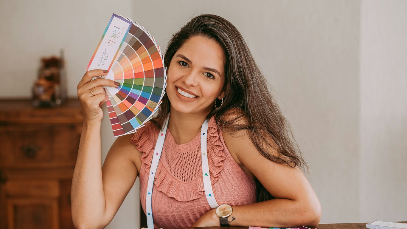 woman in white tank top reading book
