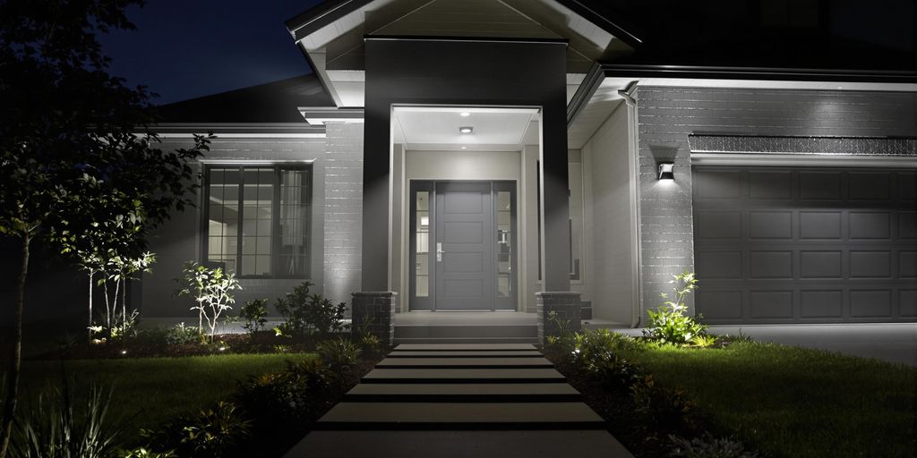 Modern home with motion sensor lighting at night.