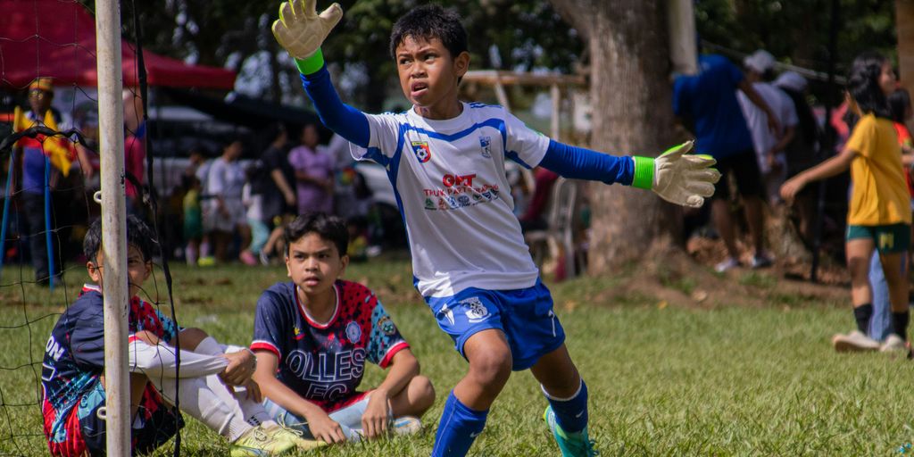 a group of young men playing a game of soccer