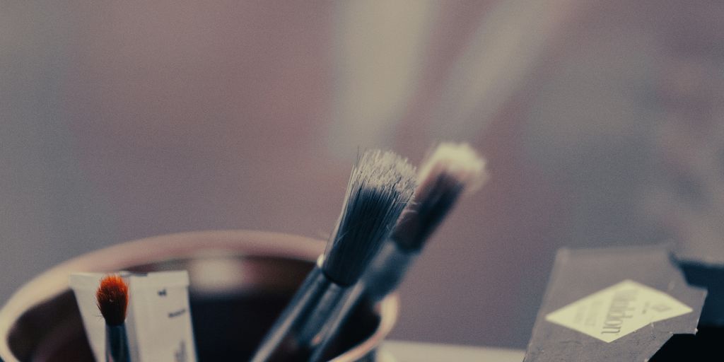 toothbrushes in a cup