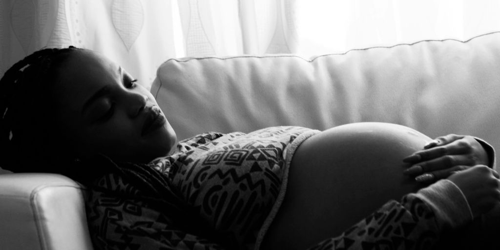 pregnant woman lying on the sofa