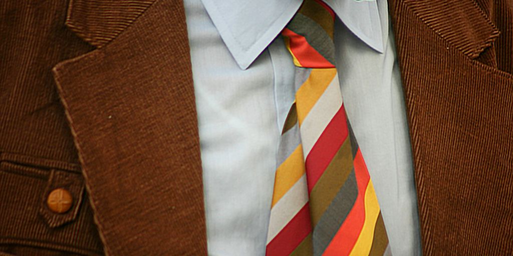 man in brown suit jacket