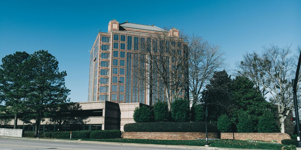 a tall building sitting next to a street