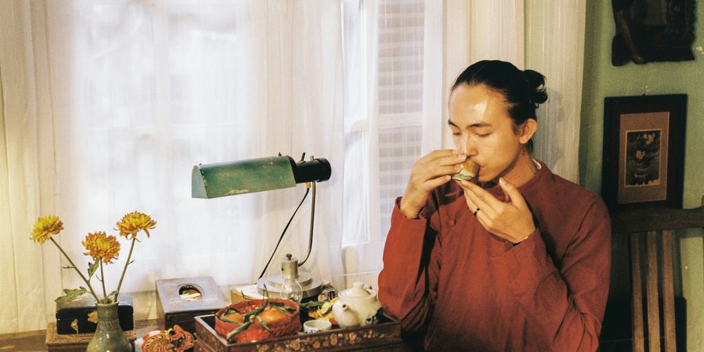 a woman sitting at a table eating food