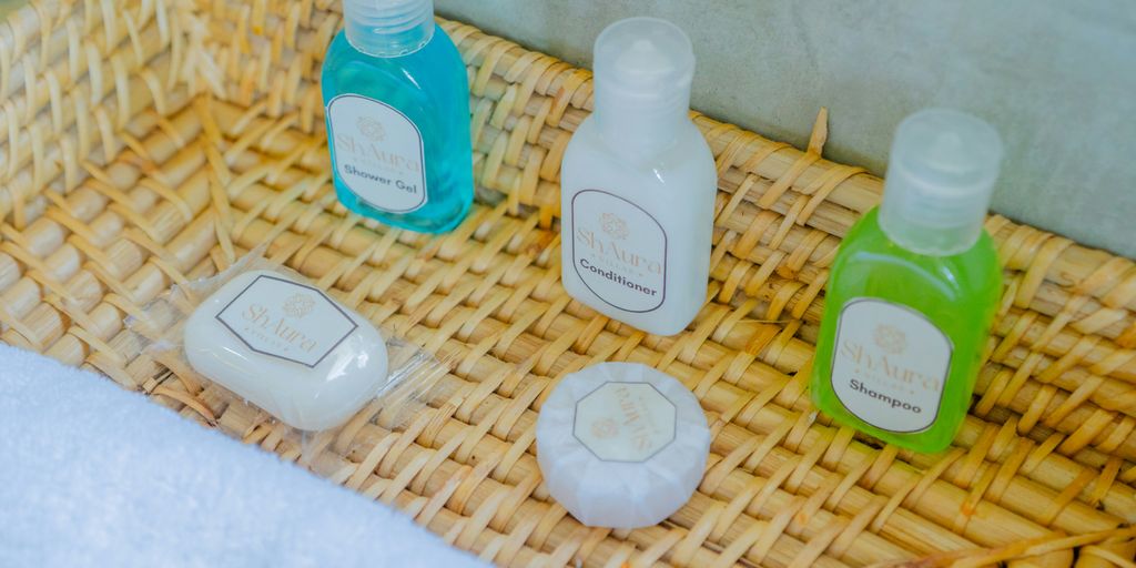 Bath products are neatly arranged in a woven basket.