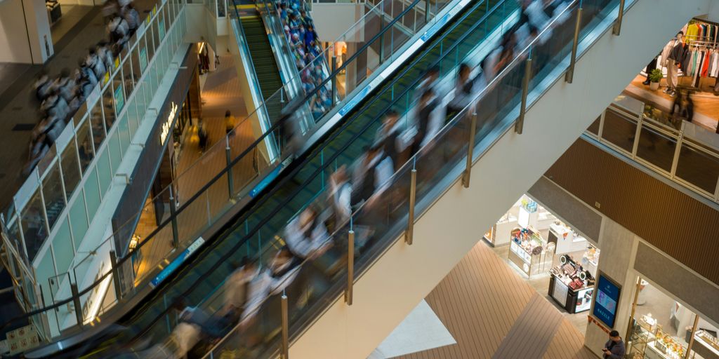 An overhead view of a shopping mall with escalators