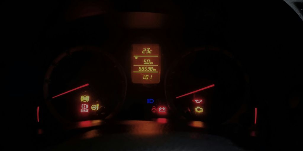 The dashboard of a car at night time