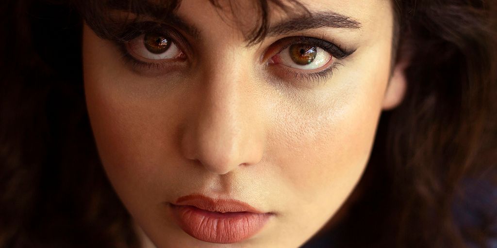 a close up of a woman with dark hair