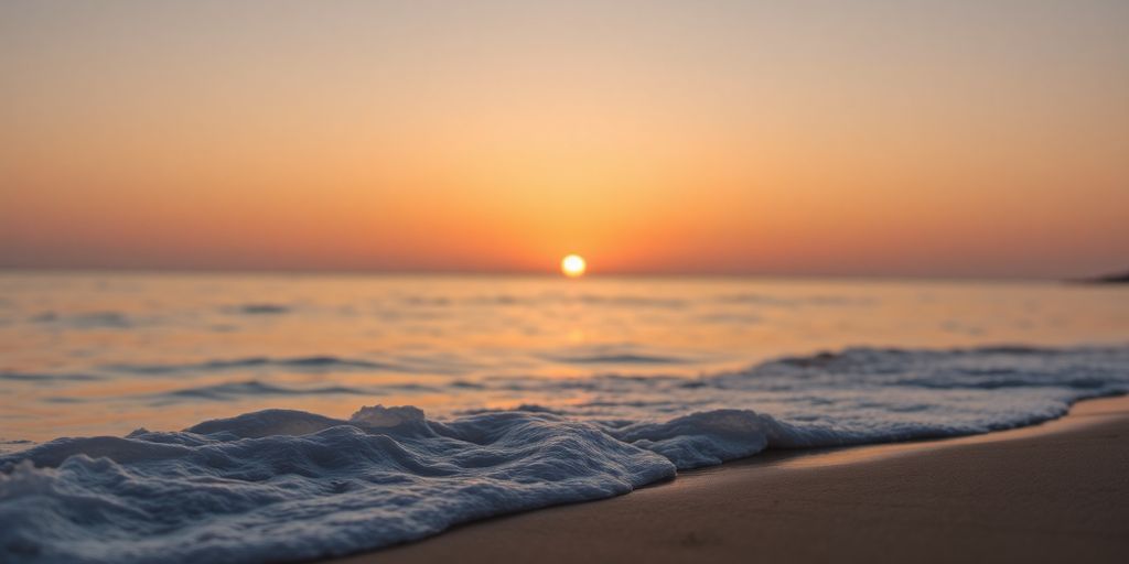 Calm beach at sunset enhancing relaxation and creativity.